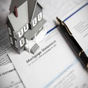 model of a house, with a pen, laid out above a mortgage statement